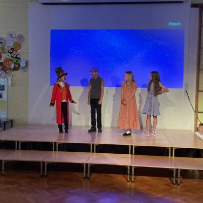 Children rehearsing for their play